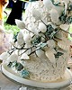 Unique green and white lace wedding cake